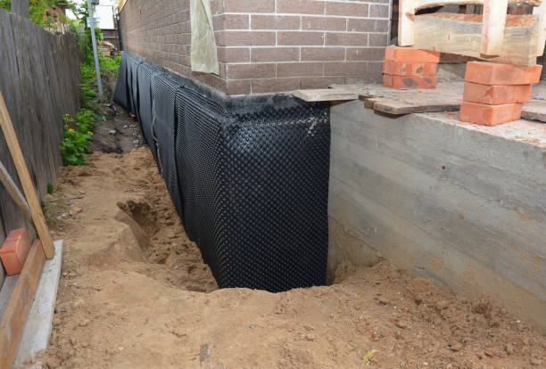 Happy homeowners after waterproofing job in Jefferson